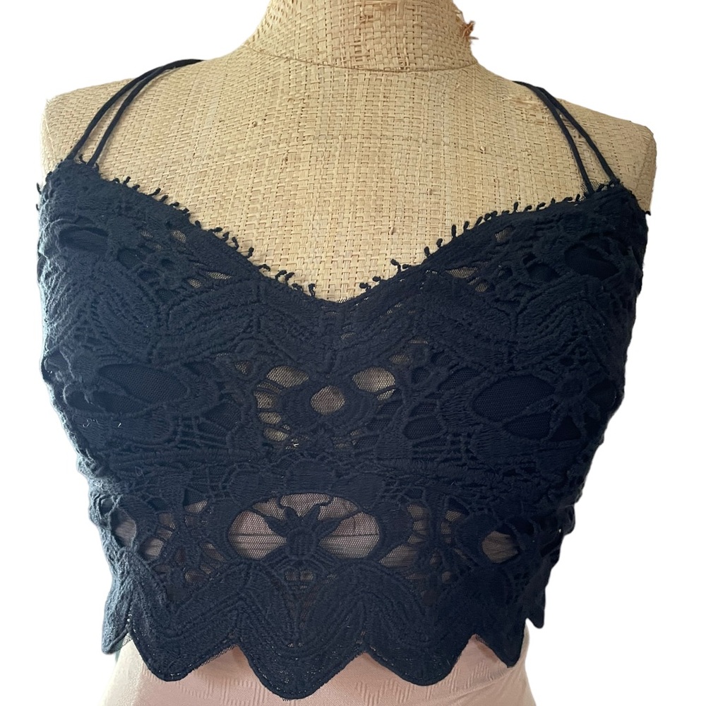 Free people lace bra top with adjustable straps. Elastic back. Size varies.